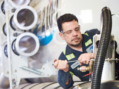 JJE Technician Working on a Hydrovac Truck